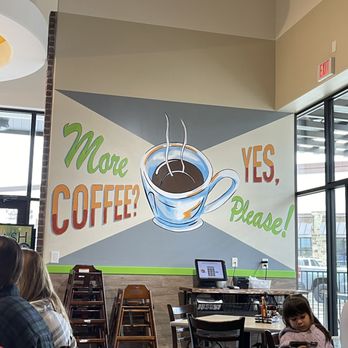 The Toasted Yolk Cafe -  a mural of a cup of coffee - Breakfast & Brunch Near Me - New Caney, Texas