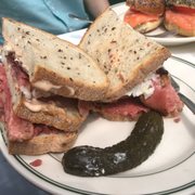 Photo of Barney Greengrass - New York, NY, United States. The #9 double decker pastrami Corned Beef Sandwich with coleslaw and russian dressing on rye w a pickle INCREDIBLE