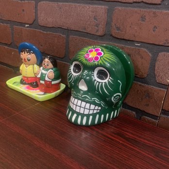 El Agave Mini Market - a mexican sugar skull and a mexican figurine - Imported Food Near Me - Hanover, Pennsylvania El Agave Mini Market - a mexican sugar skull and a mexican figurine - Imported Food Near Me - Hanover, Pennsylvania