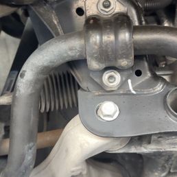 Loose bolt on lower control arm.