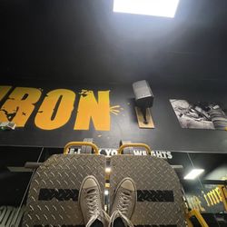 Miami Iron Gym - Ronnie Coleman in the upper right side; reminding us to warm up with light weight baby