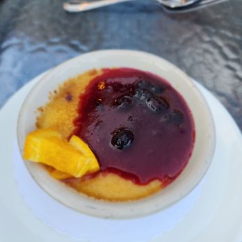 Anthony's at Spokane Falls - Creme Brulee with Huckleberry sauce and poached orange. - Seafood Near Me - Spokane, Washington