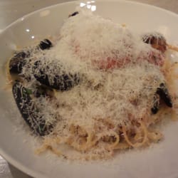 Covered with grated parmesan cheese.