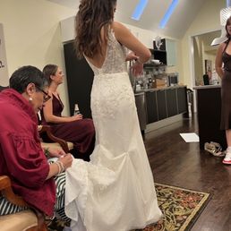 Owner of the venue sewing me a bustle