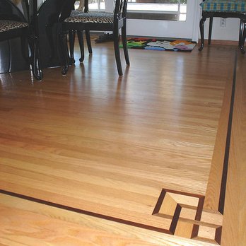 Peter Innes Hardwood Floors - a dining room with a table and chairs - Flooring Near Me - Pacifica, California Peter Innes Hardwood Floors - a dining room with a table and chairs - Flooring Near Me - Pacifica, California