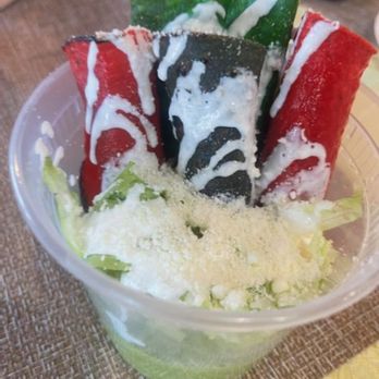 Taqiland - a plastic container with a salad in it - Food Stands Near Me - Whittier, California