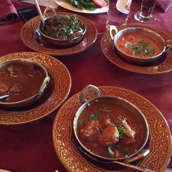 Jolly's Indian Bistro - From top left to right: Lamb Saag, Butter Chicken, Punjabi Bhoona Lamb, Malabari Chicken - Indian Near Me - Vancouver, British Columbia