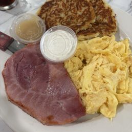 Potato pancakes, ham, and scrambled eggs. Potato pancakes, ham, and scrambled eggs.