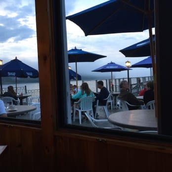 The Chart Room - Inside on an enclosed deck looking out on the harbor on a misty eve. - Seafood Near Me - Bar Harbor, Maine The Chart Room - Inside on an enclosed deck looking out on the harbor on a misty eve. - Seafood Near Me - Bar Harbor, Maine