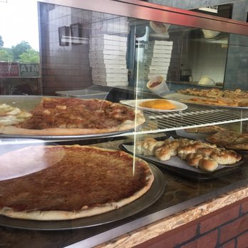 Mark's Pizza - a display of pizzas and pastries - Pizza Near Me - Spring Valley, New York