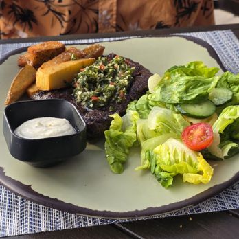 Naupaka Beach Grill - Fire-Grilled Skirt with Island Smoked Herb Chimichurri* - Cocktail Bars Near Me - Kamuela, Hawaii Naupaka Beach Grill - Fire-Grilled Skirt with Island Smoked Herb Chimichurri* - Cocktail Bars Near Me - Kamuela, Hawaii