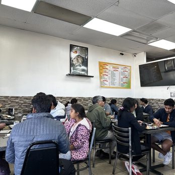 Madurai Idli Kadai - a group of people sitting at a table - Indian Near Me - Sunnyvale, California Madurai Idli Kadai - a group of people sitting at a table - Indian Near Me - Sunnyvale, California