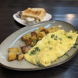 Nora's omelette (wild mushrooms, spinach & goat cheese), seasoned potatoes and sourdough toast