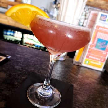 Ferrari Pizza Bar - a pink cocktail with a slice of orange - Pizza Near Me - Chili, New York Ferrari Pizza Bar - a pink cocktail with a slice of orange - Pizza Near Me - Chili, New York