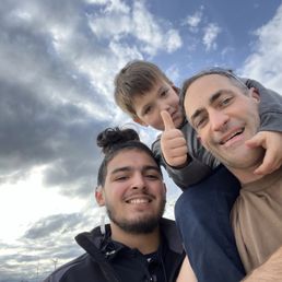 Awesome staff member from Tommy's, Sebastian with my family after a wash Awesome staff member from Tommy's, Sebastian with my family after a wash