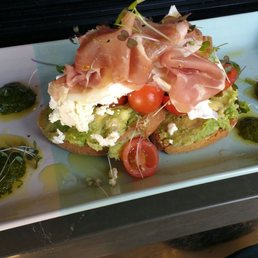 Delicious Dean. Smashed avocados, cherry tomatoes, goat cheese, prosciutto and basil pesto Delicious Dean. Smashed avocados, cherry tomatoes, goat cheese, prosciutto and basil pesto