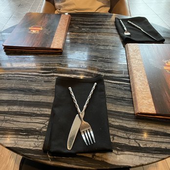 Guy Fieri's Cherokee Kitchen + Bar - Pretty table/cool utensils - New American Near Me - Cherokee, North Carolina Guy Fieri's Cherokee Kitchen + Bar - Pretty table/cool utensils - New American Near Me - Cherokee, North Carolina