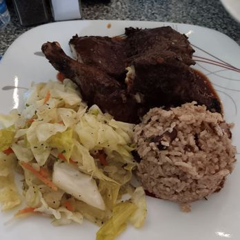 Lucian's Caribbean Grill - Lunch portion - Jerk chicken with sautéed cabbage, and rice and beans - Caribbean Near Me - Houston, Texas Lucian's Caribbean Grill - Lunch portion - Jerk chicken with sautéed cabbage, and rice and beans - Caribbean Near Me - Houston, Texas