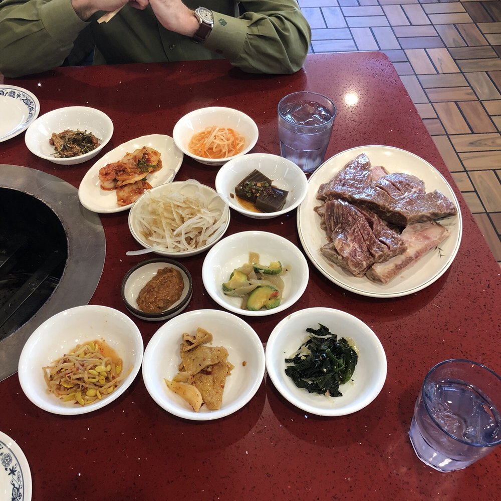 Mapo BBQ - A ton of appetizers before the beef ribs are cooked and all of it is delicious. - Korean Near Me - Flushing, New York