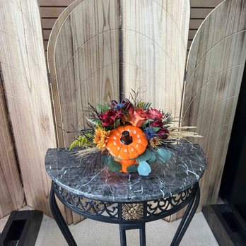 Dafferdil Floral Creations - Fall themed arrangement in a ceramic pumpkin including red alstroemeria, yellow solidago, coffee break roses, and fall foliage. - Florists Near Me - Meridian, Idaho Dafferdil Floral Creations - Fall themed arrangement in a ceramic pumpkin including red alstroemeria, yellow solidago, coffee break roses, and fall foliage. - Florists Near Me - Meridian, Idaho