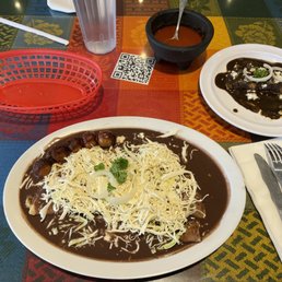 Enfrijoladas and enchilada with mole negro.