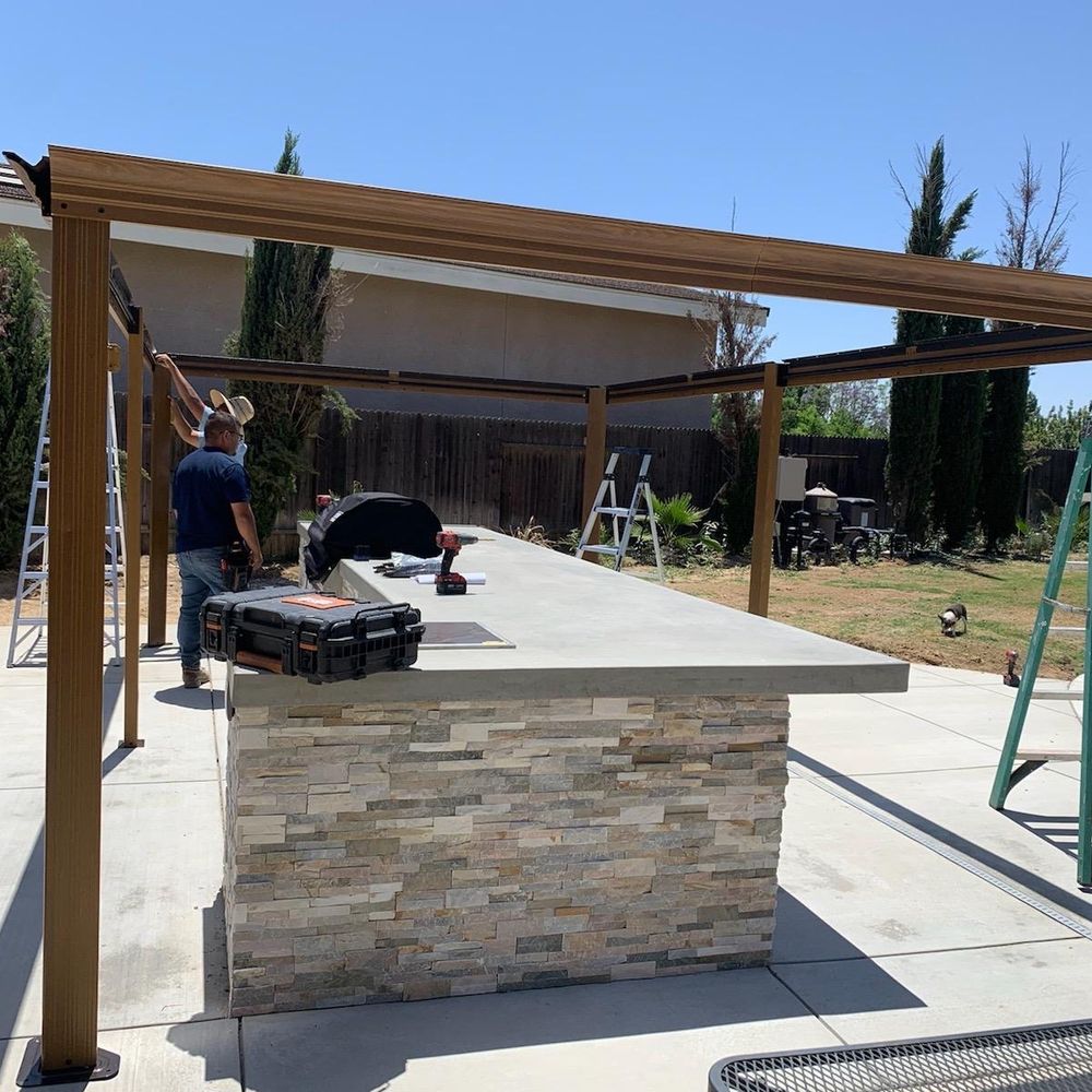 Assembling large gazebo over outdoor bbq island Assembling large gazebo over outdoor bbq island