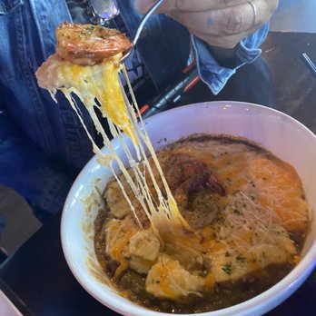 Neil St Blues - Shrimp & Grits. Looks amazing but had too much cheese - Cocktail Bars Near Me - Champaign, Illinois