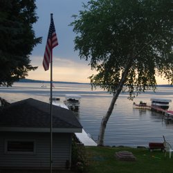 On Green Lake Rentals - Sandy Shore Cottage....Look down the center of the lake, while enjoying this 3 bedroom, 2 bath home on Green Lake, WI.