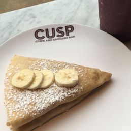 Peanut butter crepe and strawberry blueberry smoothie. Peanut butter crepe and strawberry blueberry smoothie.