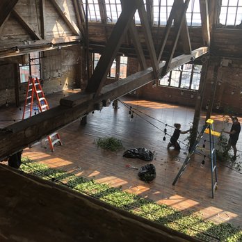 Greenpoint Loft - View from the mezzanine, wedding prep in progress - Venues & Event Spaces Near Me - New York, New York