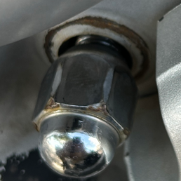 Damaged lug bolt. The lug nut is fully screwed on, and you can see the bolt drooping. Damaged lug bolt. The lug nut is fully screwed on, and you can see the bolt drooping.