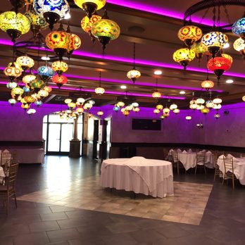 Sahara Restaurant - tables with white linens and colorful lamps - Mediterranean Near Me - Manville, New Jersey Sahara Restaurant - tables with white linens and colorful lamps - Mediterranean Near Me - Manville, New Jersey