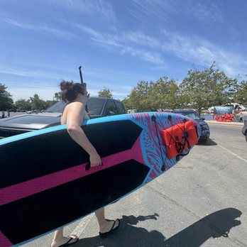 Lake Natoma - Seri bringing one paddle board to the water. This one will be mine to use for the day. Looks big but not heavy. I can lift it. Julie A - Lakes Near Me - Folsom, California Lake Natoma - Seri bringing one paddle board to the water. This one will be mine to use for the day. Looks big but not heavy. I can lift it. Julie A - Lakes Near Me - Folsom, California