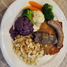 Tannenbaum platter, bratwurst, beef rouladin, schnitzel, spaetzle, red cabbage. Tannenbaum platter, bratwurst, beef rouladin, schnitzel, spaetzle, red cabbage.