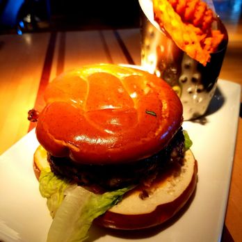 Root Down DIA - Pretzel bacon burger with sweet potato fries - New American Near Me - Denver, Colorado Root Down DIA - Pretzel bacon burger with sweet potato fries - New American Near Me - Denver, Colorado
