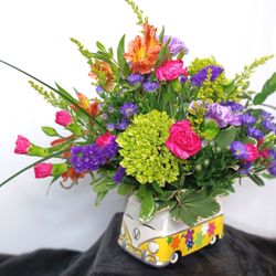 Miss Daisy's Floral & Event Decor - Miss Daisy's exclusive design, Feeling Groovy pink, purple, green, and orange blooms designed in our hippy van.