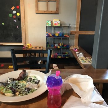 Sunriver Brewing Co - Sunriver Pub - Kid play area and strong effort to finish a big lunch salad - Brewpubs Near Me - Sunriver, Oregon
