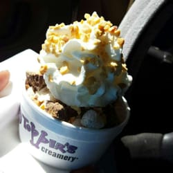 Small sundae with peanut butter cups and cookie dough. Whip cream top with nuts  $3.75