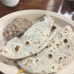 Tres Hermanos Restaurant - Two Tacos Chorizo and egg and a bacon potato and egg.