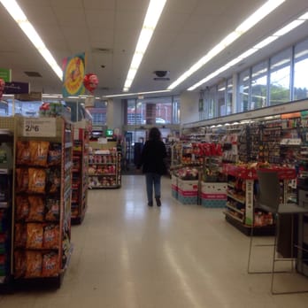 Walgreens - a man walking down a grocery aisle - Drugstores Near Me - Holyoke, Massachusetts