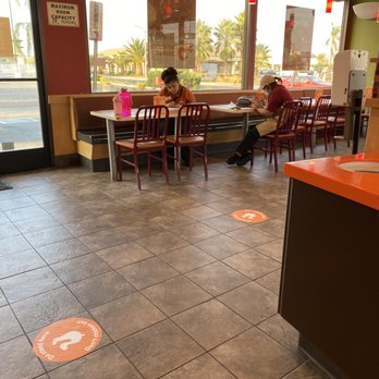 Popeyes Louisiana Kitchen - a woman sitting at a table in a fast food restaurant - Fast Food Near Me - Perris, California Popeyes Louisiana Kitchen - a woman sitting at a table in a fast food restaurant - Fast Food Near Me - Perris, California