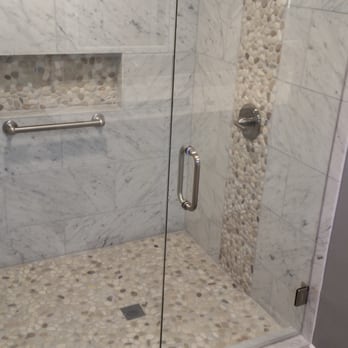Cornerstone Handyman Services - New marble shower with accent rocks on floor and vertically. - Handyman Near Me Cornerstone Handyman Services - New marble shower with accent rocks on floor and vertically. - Handyman Near Me