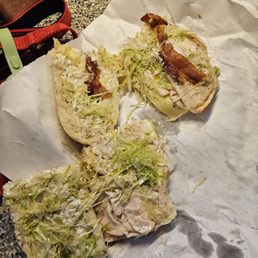 One tiny piece of bacon on half the sub.
