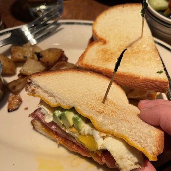 Blackfinn Ameripub - DC - a person holding a sandwich on a plate - Sports Bars Near Me - Washington, DC, District of Columbia Blackfinn Ameripub - DC - a person holding a sandwich on a plate - Sports Bars Near Me - Washington, DC, District of Columbia