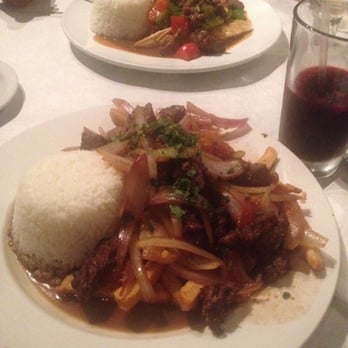 Lola's Peruvian Restaurant - Lomo saltado is a stir fry that combines marinated strips of sirloin, with onions, tomatoes and served with fries. - Latin American Near Me - Glendale, California Lola's Peruvian Restaurant - Lomo saltado is a stir fry that combines marinated strips of sirloin, with onions, tomatoes and served with fries. - Latin American Near Me - Glendale, California