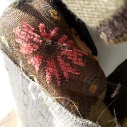 Stitch Maker - Willie Whiteside left the original fabric on the chair without removing it as a professional upholsterer should.