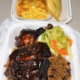Jerk Chicken, Rice And Peas, Cabbage, Mac&Cheese and Chicken Patty. Jerk Chicken, Rice And Peas, Cabbage, Mac&Cheese and Chicken Patty.