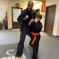 Muhammad's Boxing & Martial Arts - My son with Master Yusuf Muhammad after he received his orange belt in Karate! #kongfu #karate