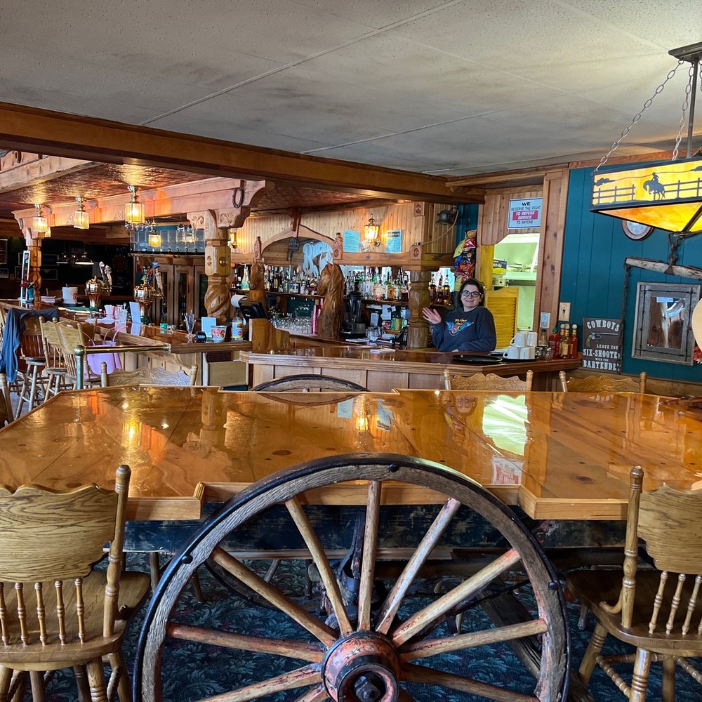 Buckboard Saloon - a large wooden table and chairs - American Near Me - Danville, Washington Buckboard Saloon - a large wooden table and chairs - American Near Me - Danville, Washington