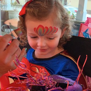 Adrenaline Entertainment - My daughter getting her face painted for the very first time and smiling so big when it was done. - Clowns Near Me